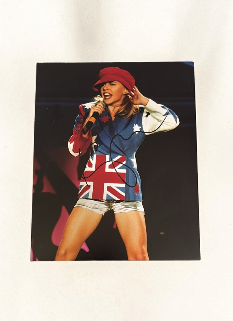 Kylie Minogue Signed Photograph: This lot is a 10x8" photograph, autographed by Kylie Minogue. If you wish to upgrade to a third party authentication with holographic QR code and item scoring, an additional charge of 30 UK Pound woul