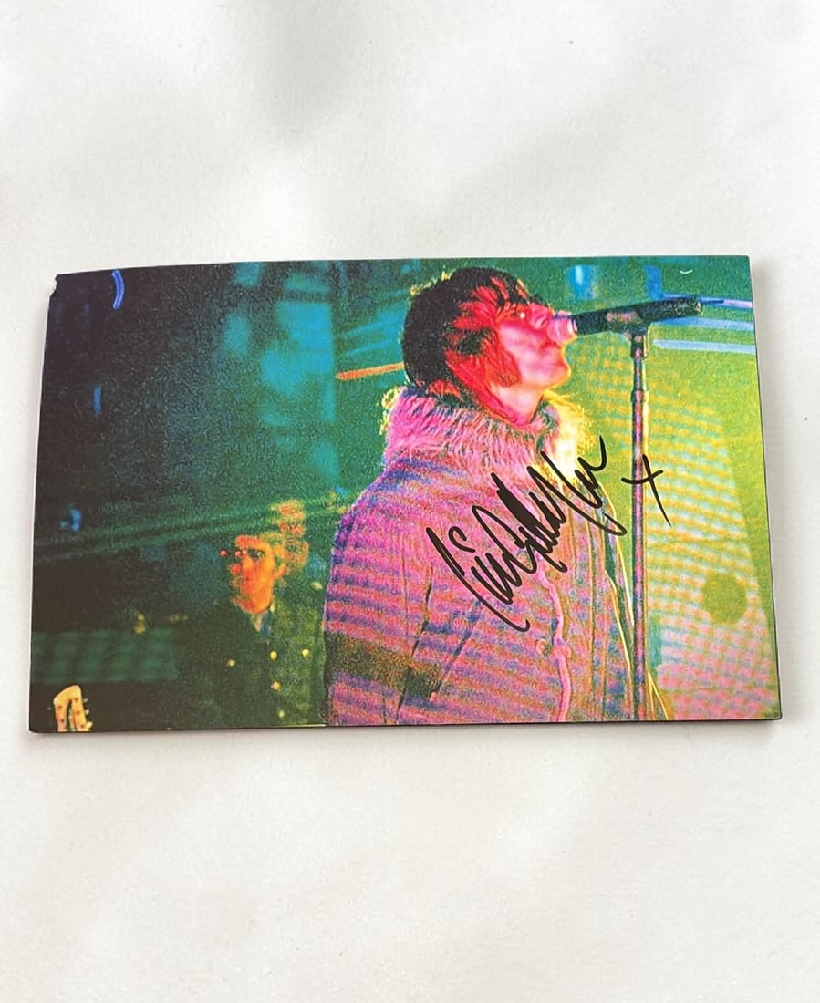 Liam Gallagher Oasis Signed Photograph: This lot is a 12x8" photograph, autographed by Liam Gallagher of Oasis. If you wish to upgrade to a third party authentication with holographic QR code and item scoring, an additional charge of 30 UK 
