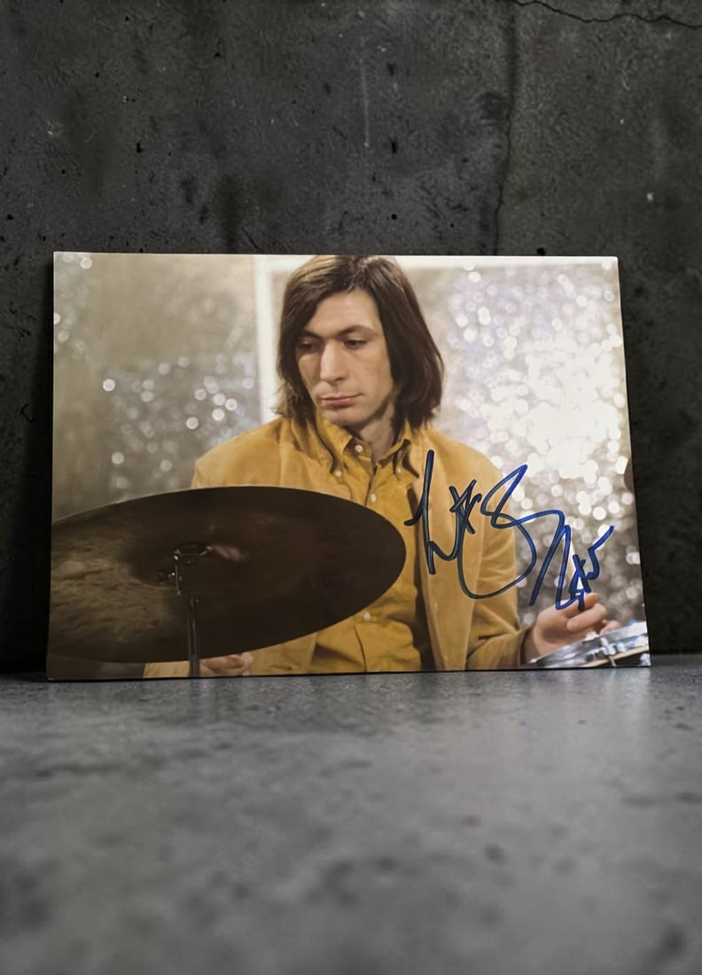 Charlie Watts The Rolling Stones Signed Photograph: This lot is a 7x5" photograph, autographed by Charlie Watts of The Rolling Stones. If you wish to upgrade to a third party authentication with holographic QR code and item scoring, an additional charg