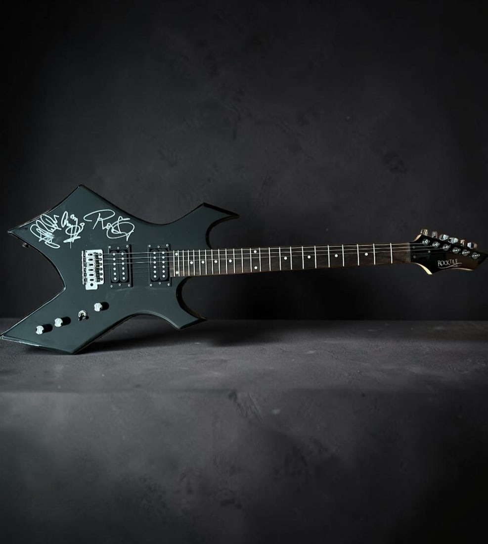 Led Zeppelin Signed B.C. Rich Warlock Electric Guitar: This lot is a B.C. Rich Warlock electric guitar, autographed on the body by John Paul Jones, Robert Plant and Jimmy Page of Led Zeppelin. If you wish to upgrade to a third party authentication with
