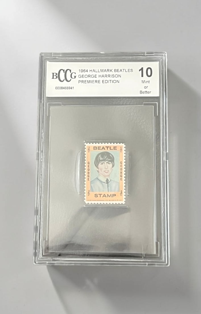 George Harrison The Beatles Beckett 10 Hallmark Stamp: This lot is a Hallmark Stamp (Beckett 10 1964), featuring George Harrison of The Beatles. Item comes with Beckett authentication.