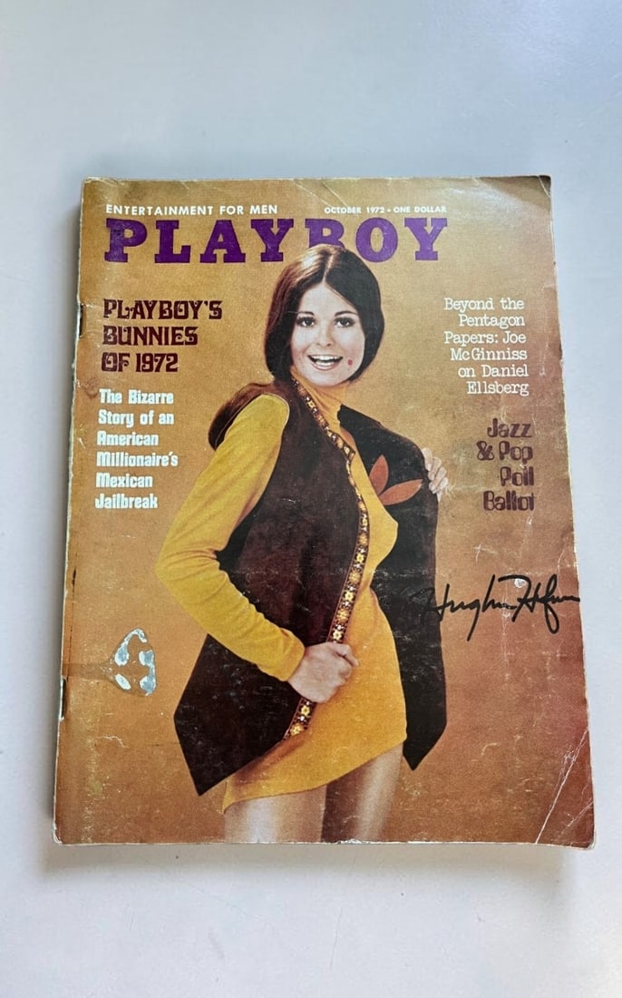 Hugh Hefner Signed Playboy Magazine: This lot is a Playboy Magazine (October 1972), autographed by Hugh Hefner. If you wish to upgrade to a third party authentication with holographic QR code and item scoring, an additional charge of 30