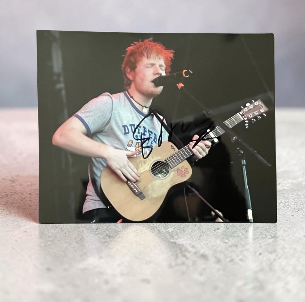Ed Sheeran Signed Photograph: This lot is a photograph, autographed by Ed sheeran. If you wish to upgrade to a third party authentication with holographic QR code and item scoring, an additional charge of 30 UK Pound would be appl