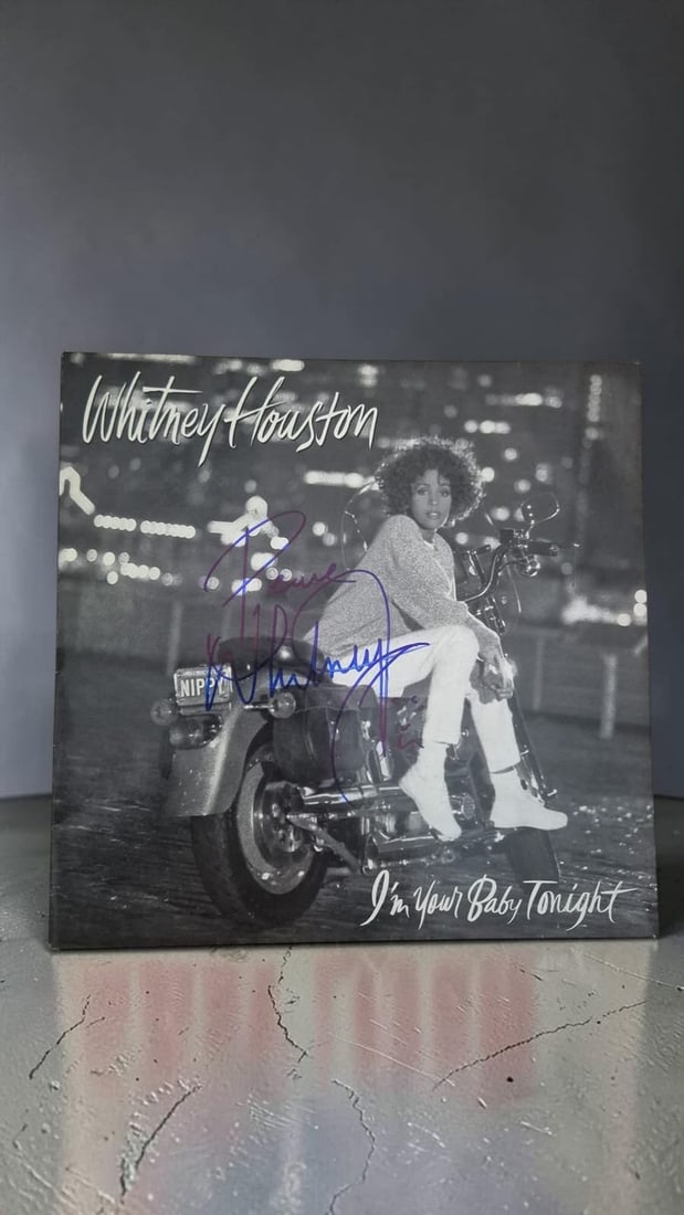 Whitney Houston I'm your baby tonight Signed 12" Vinyl: This lot is a 12" vinyl (I'm your baby tonight), autographed by Whitney Houston. If you wish to upgrade to a third party authentication with holographic QR code and item scoring, an additional charge 