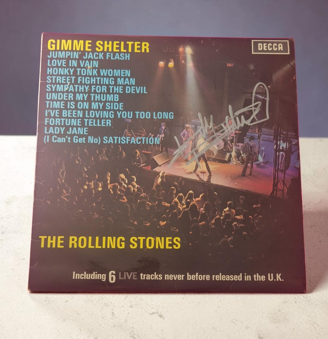 Keith Richards The Rolling Stones Gimme Shelter Signed Vinyl LP: This lot is a vinyl LP (Gimme Shelter), autographed by Keith Richards of The Rolling Stones. If you wish to upgrade to a third party authentication with holographic QR code and item scoring, an additi