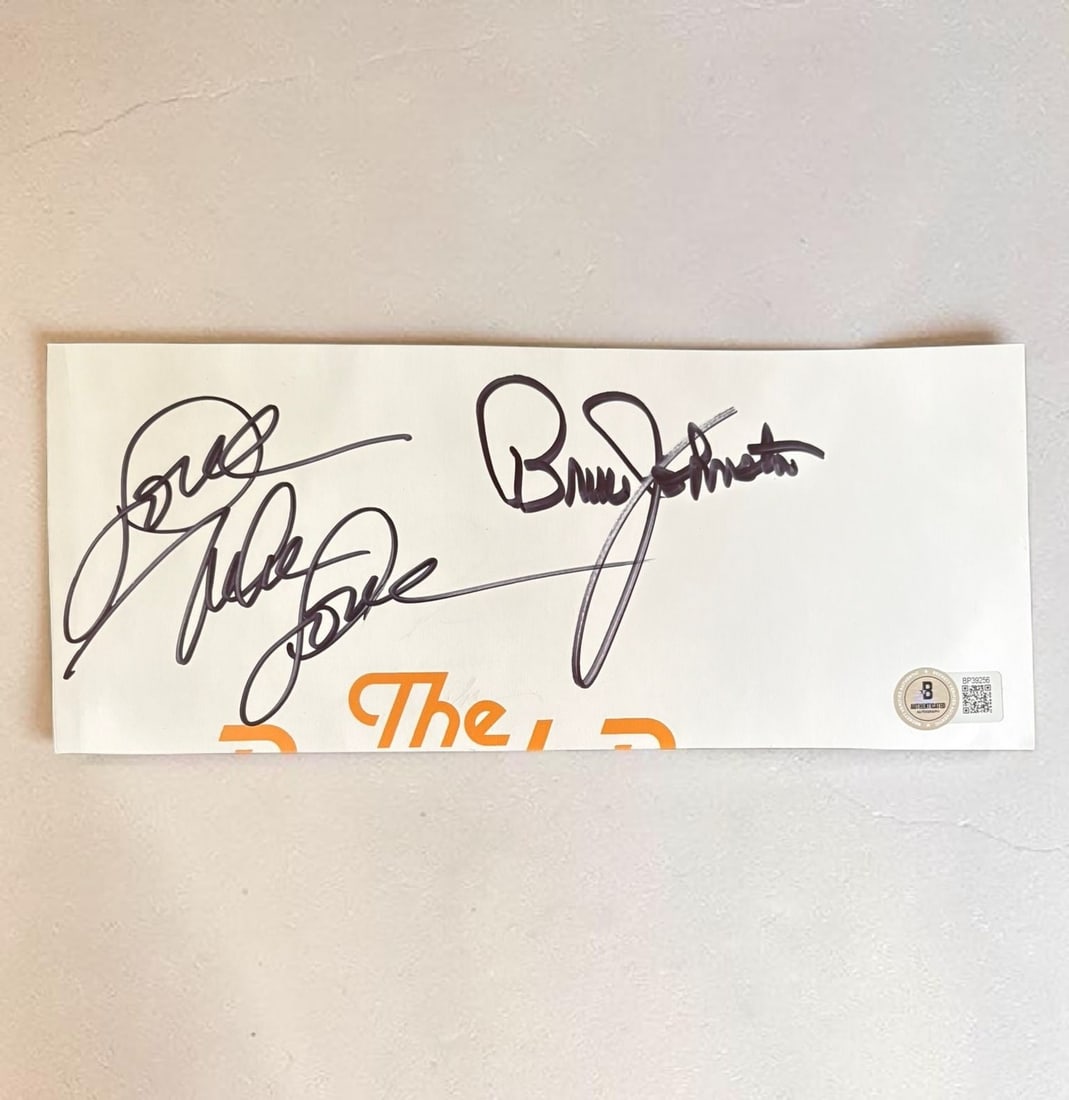Brian Johnston And Mike Love Beach Boys Signed Cut Beckett BAS Authentication: This lot is a cut from an official book, autographed by Brian Johnston and Mike Love of The Beach Boys. Item comes with Beckett BAS authentication. If you wish to upgrade to a third party authenticati