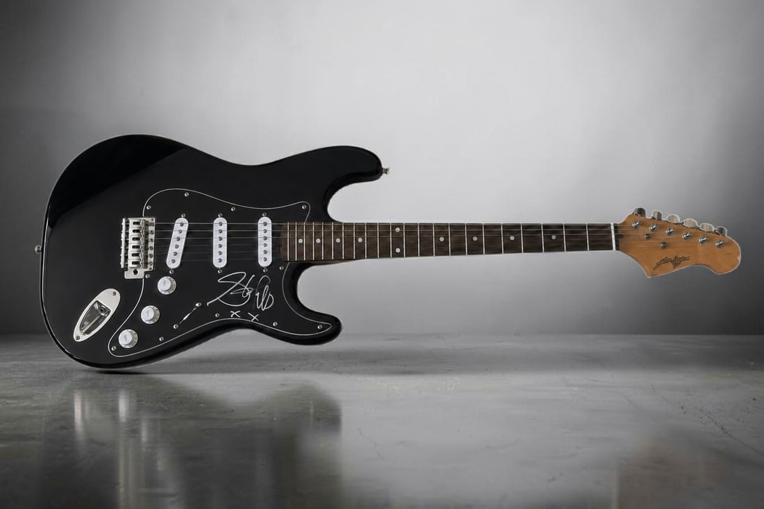 Steven Tyler Aerosmith Signed Electric Guitar: This Lot is an electric guitar, autographed on the pickguard by Steven Tyler of Aerosmith. If you wish to upgrade to a third party authentication with holographic QR code and item scoring, an addition