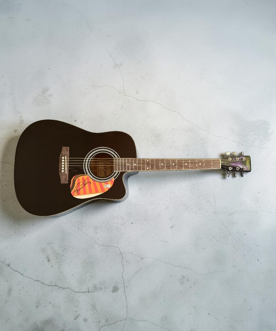 Roger Daltrey The Who Signed Acoustic Guitar Beckett BAS Authenticated: This lot is an acoustic guitar, autographed by Roger Daltrey of The Who. Item comes with Beckett BAS authentication. If you wish to upgrade to a third party authentication with holographic QR code and