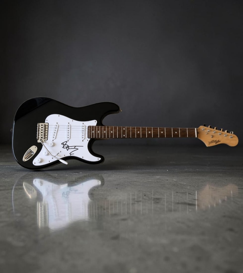 Bruce Dickinson Iron Maiden Signed Electric Guitar: This lot is an electric guitar, autographed by Bruce Dickinson of Iron Maiden. If you wish to upgrade to a third party authentication with holographic QR code and item scoring, an additional charge