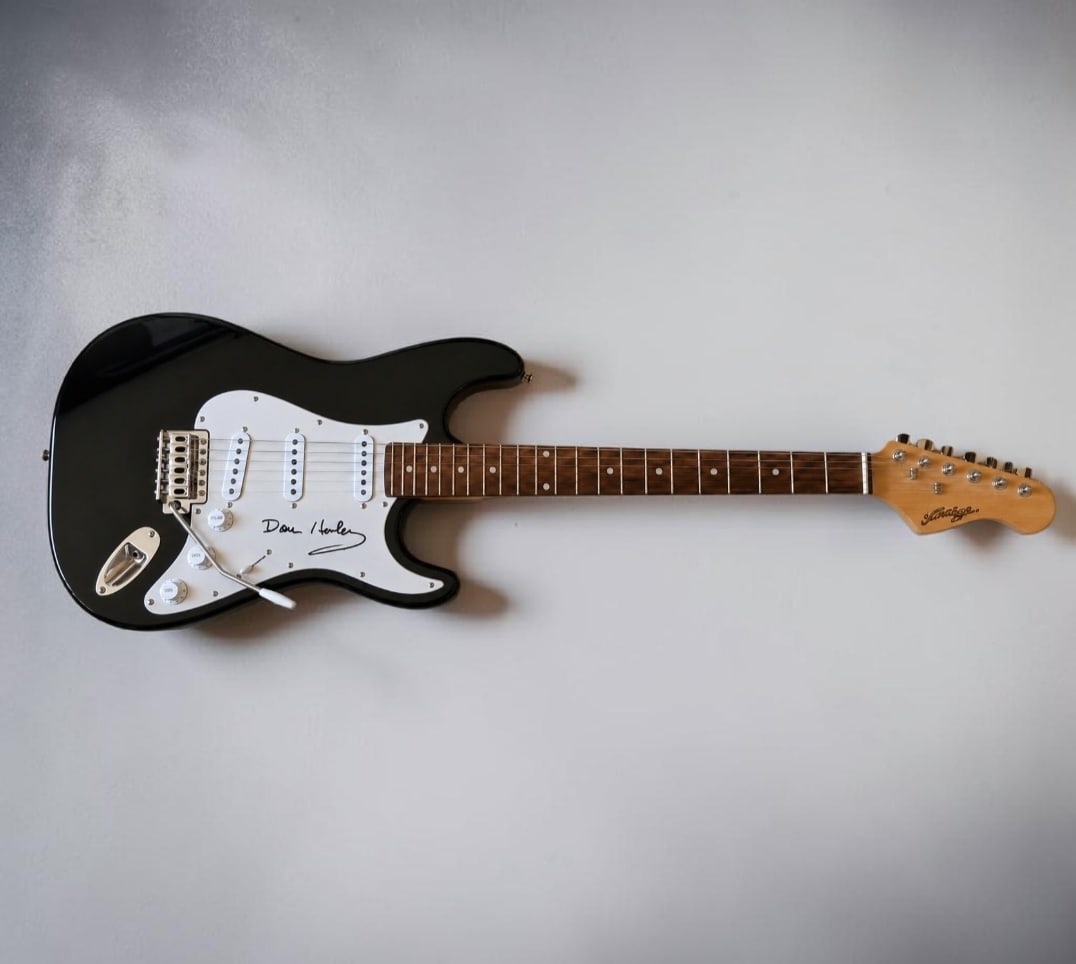 Don Henley Eagles Signed Electric Guitar: This lot is an electric guitar, autographed by Don Henley of the Eagles. If you wish to upgrade to a third party authentication with holographic QR code and item scoring, an additional charge of 30