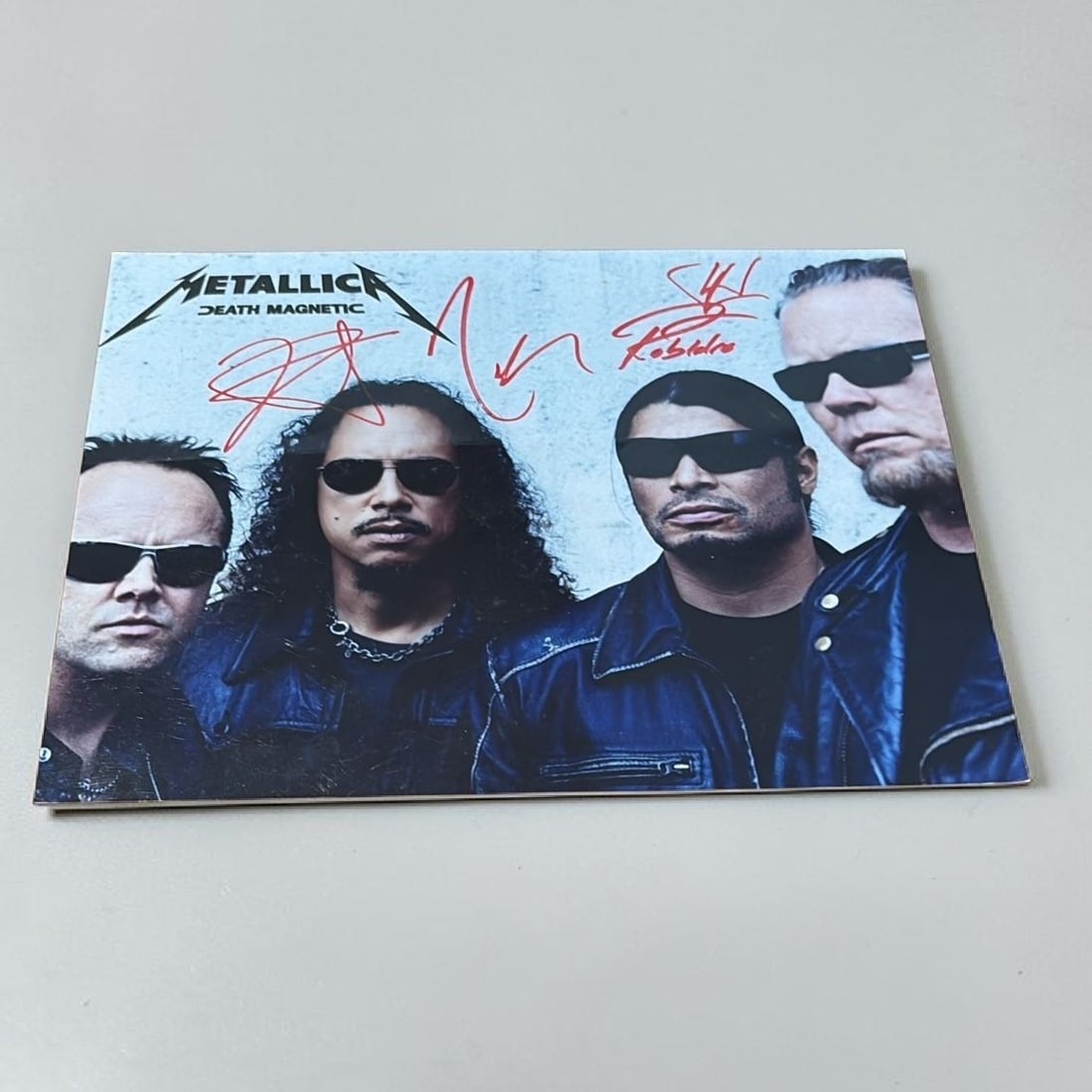 Metallica Signed Photograph: This lot is a 10x8" photograph, autographed by James Hetfield, Lars Ulrich, Kirk Hammett and Robert Trujillo of Metallica. If you wish to upgrade to a third party authentication with holographic QR co
