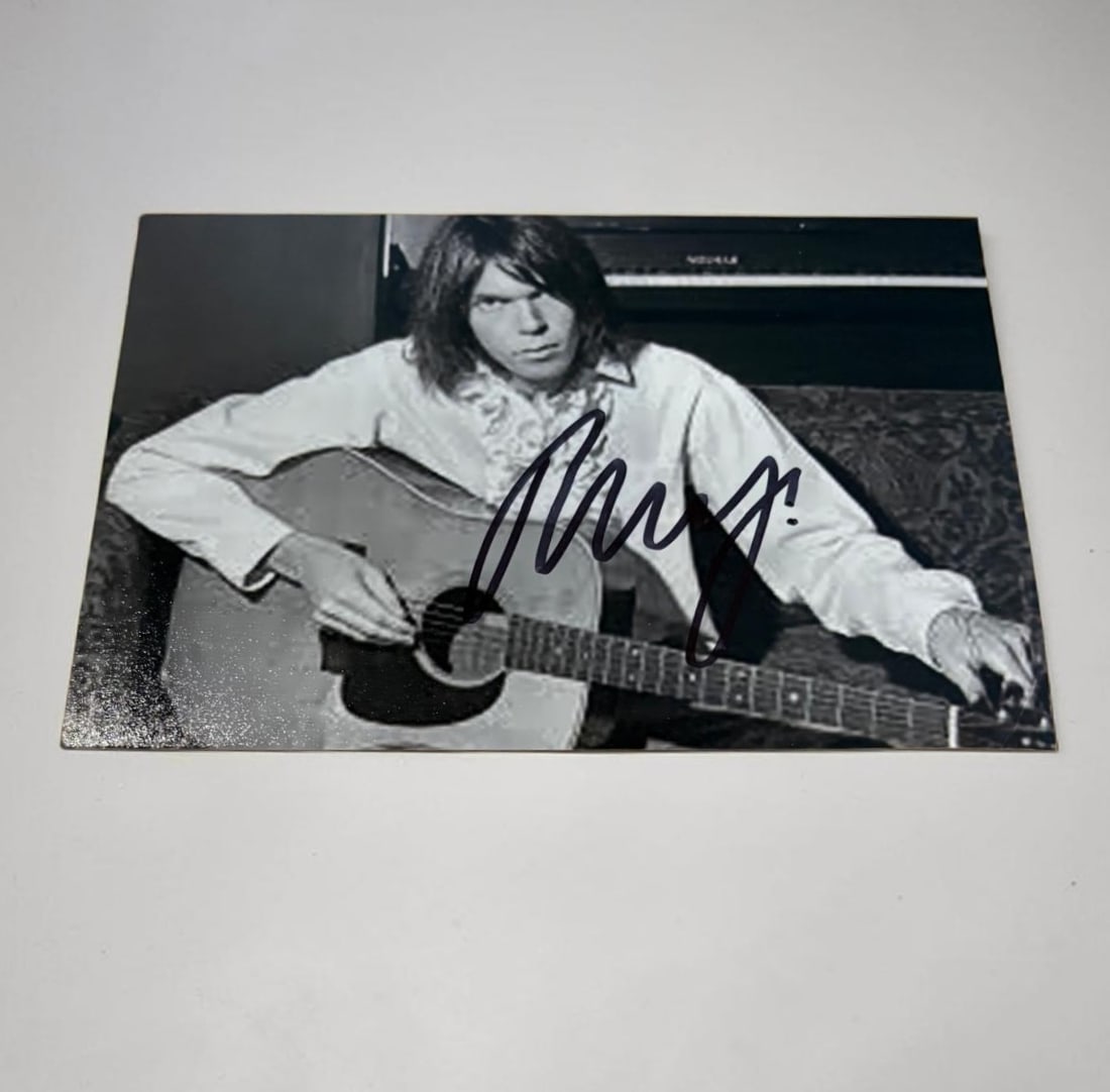 Neil Young Signed Photograph: This lot is a 5x3" photograph, autographed by Neil Young. If you wish to upgrade to a third party authentication with holographic QR code and item scoring, an additional charge of 30 UK Pound would be