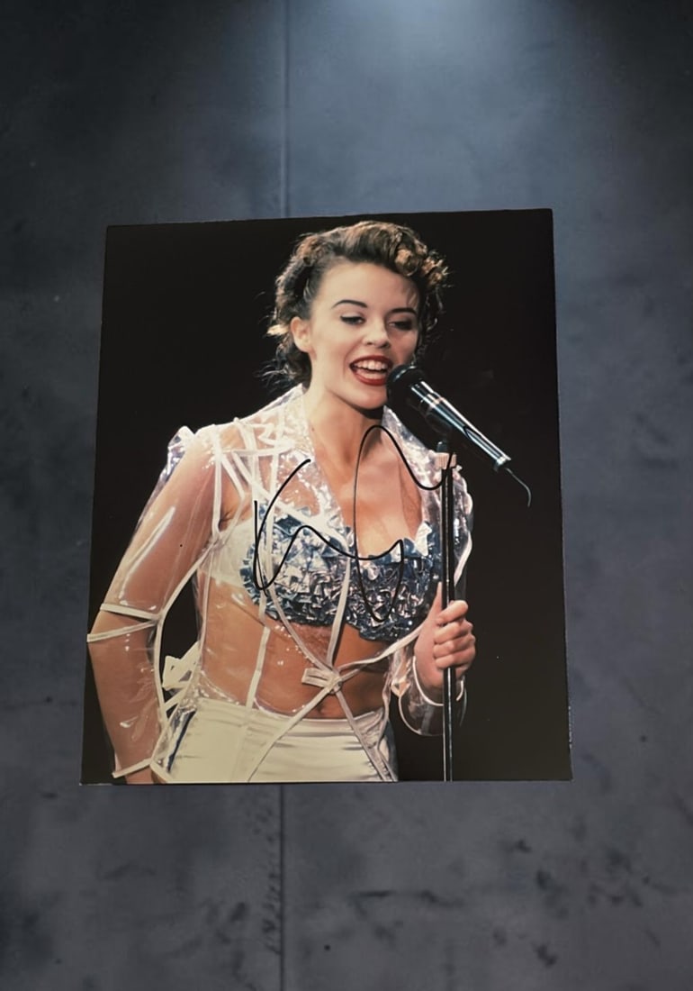 Kylie Minogue Signed Photograph: This lot is a 10x8 photograph, autographed by Kylie Minogue. If you wish to upgrade to a third party authentication with holographic QR code and item scoring, an additional charge of 30 UK Pound