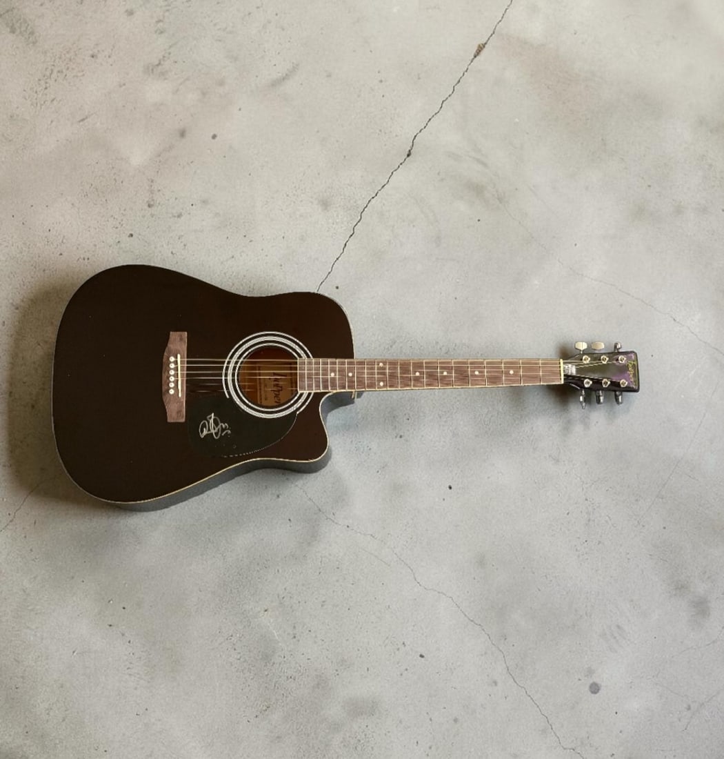 Robert Plant Led Zeppelin Signed Acoustic Guitar: This lot is an acoustic guitar, autographed by Robert Plant of Led Zeppelin. If you wish to upgrade to a third party authentication with holographic QR code and item scoring, an additional charge of 3