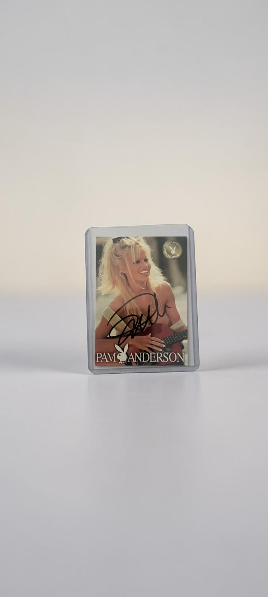 Pamela Anderson Signed Playboy Collectors Card: This lot is a Playboy collectors card (Fun In The Sun November 1994), autographed on the front of the card by Pamela Anderson. If you wish to upgrade to a third party authentication with holographic Q