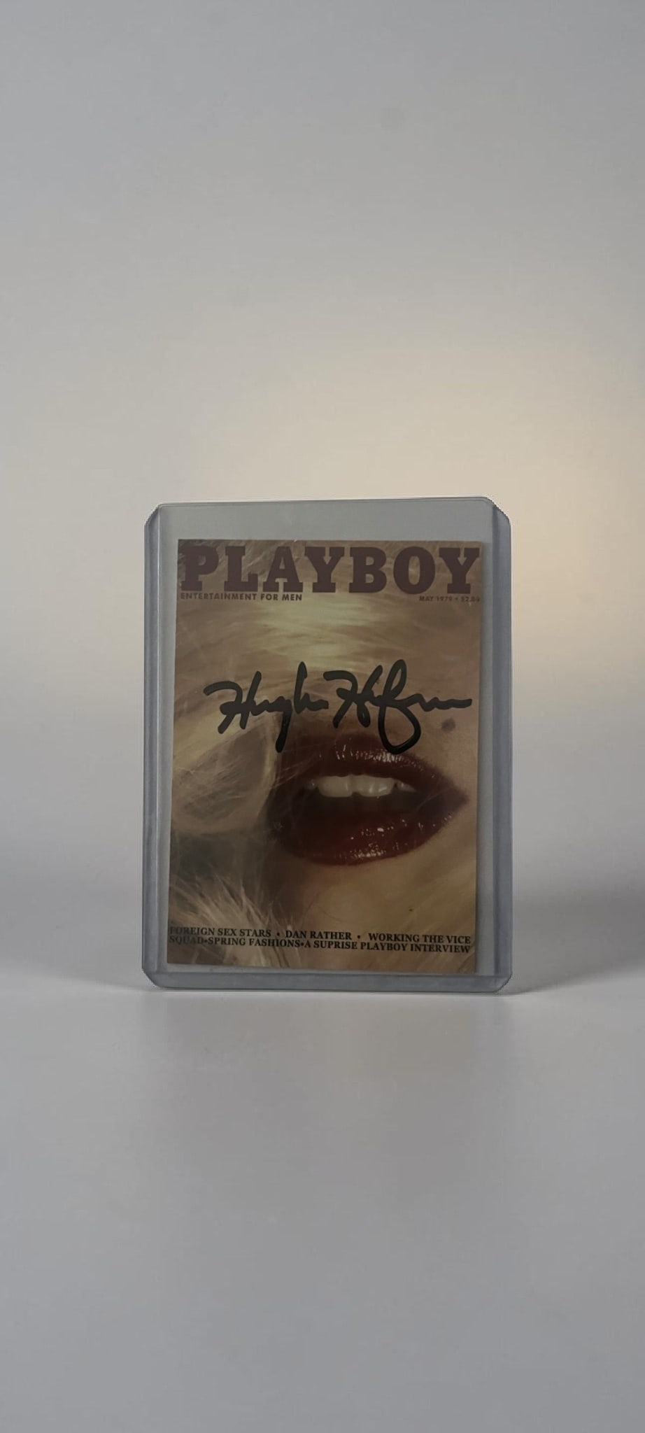 Hugh Hefner Signed Playboy Collectors Card: This lot is a Playboy collectors card (May 1979), autographed on the front of the card by Hugh Hefner. If you wish to upgrade to a third party authentication with holographic QR code and item