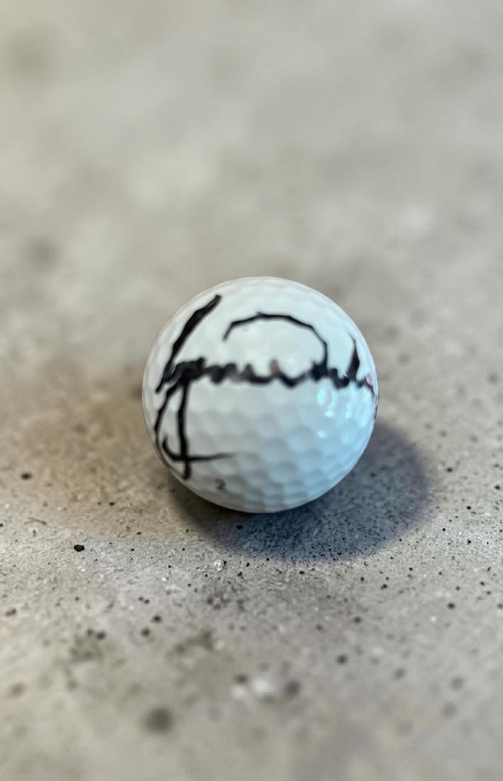 Tiger Woods Signed Golf Ball: This lot is a golf ball, autographed by Tiger Woods. If you wish to upgrade to a third party authentication with holographic QR code and item scoring, an additional charge of 30 UK Pound would be appl