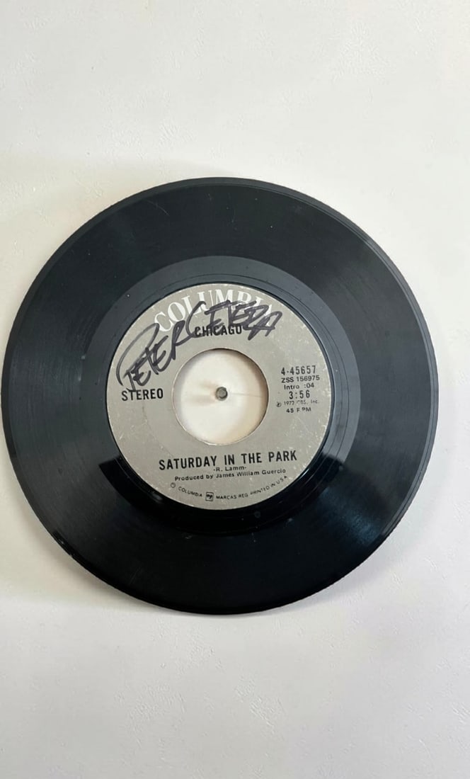 Peter Cetera Signed Vinyl Disc Only: This lot is a vinyl disc only (Saturday In The Park), autographed on the front of the vinyl disc by Peter Cetera. If you wish to upgrade to a third party authentication with holographic QR code and it