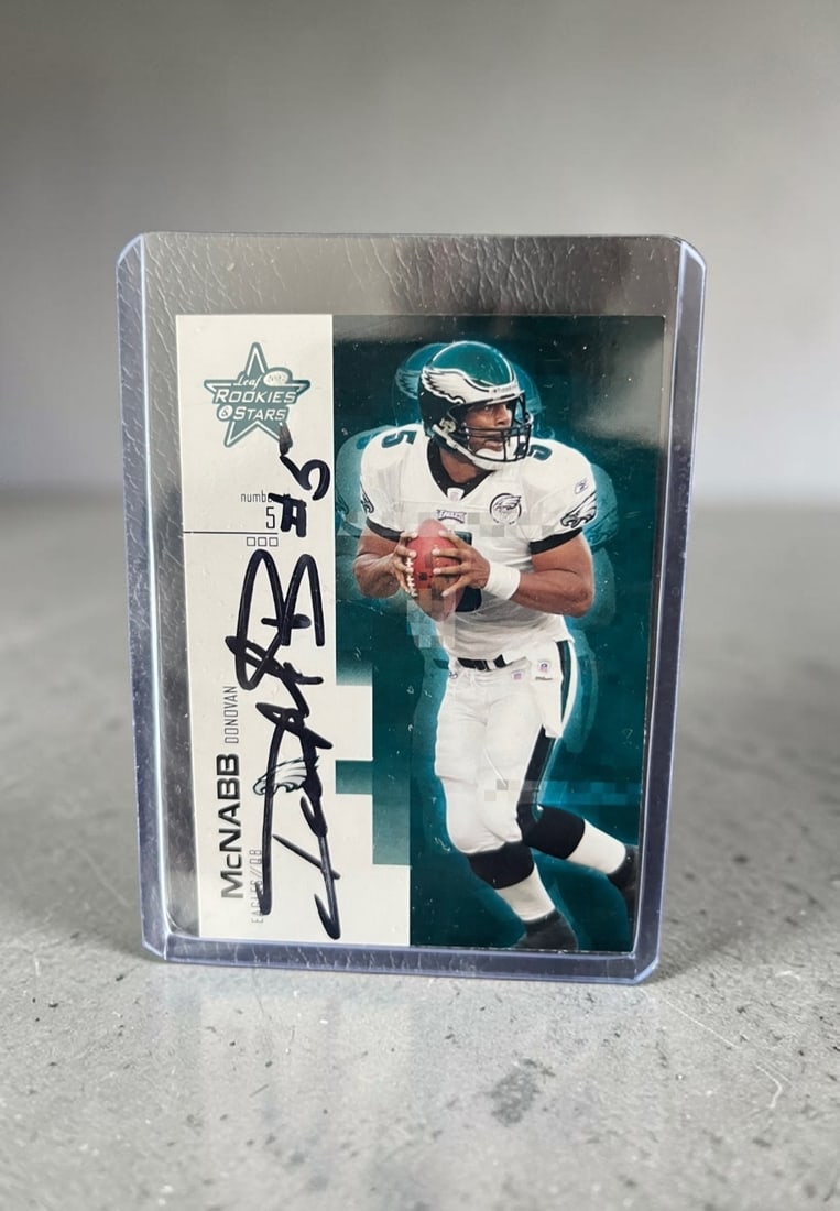 Donovan McNab Signed Rookies And Stars Collectors Card: This lot is a Rookies And Stars collectors card, autographed by Donovan McNab. If you wish to upgrade to a third party authentication with holographic QR code and item scoring, an additional charge of