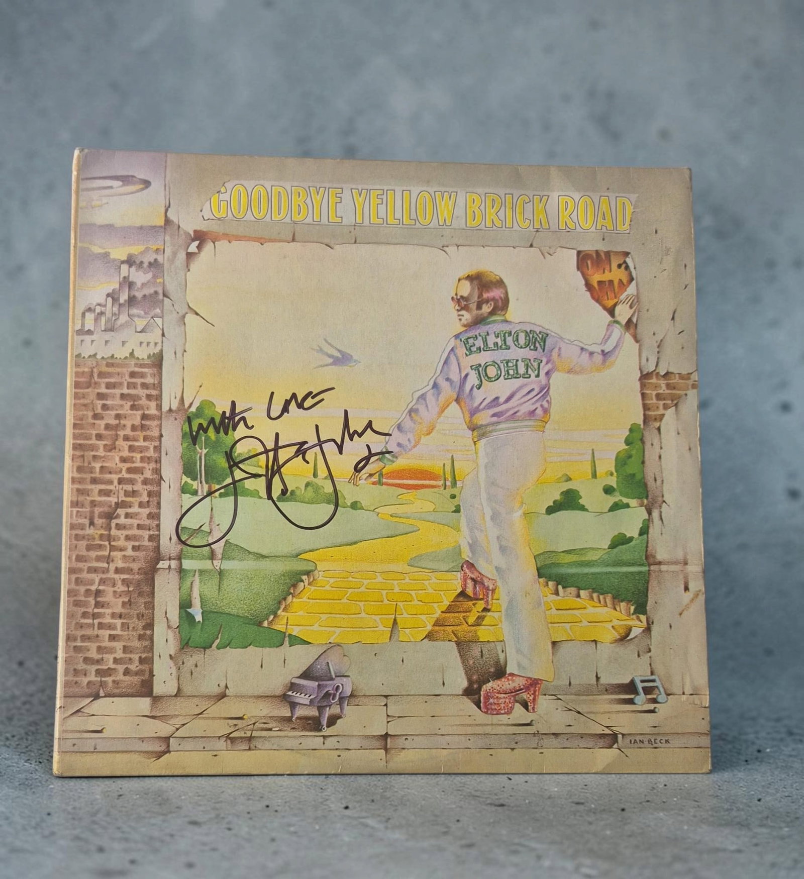 Elton John Goodbye Yellow Brick Road Signed Vinyl LP: This lot is a vinyl LP (Goodbye Yellow Brick Road), autographed by Elton John. If you wish to upgrade to a third party authentication with holographic QR code and item scoring, an additional charge of