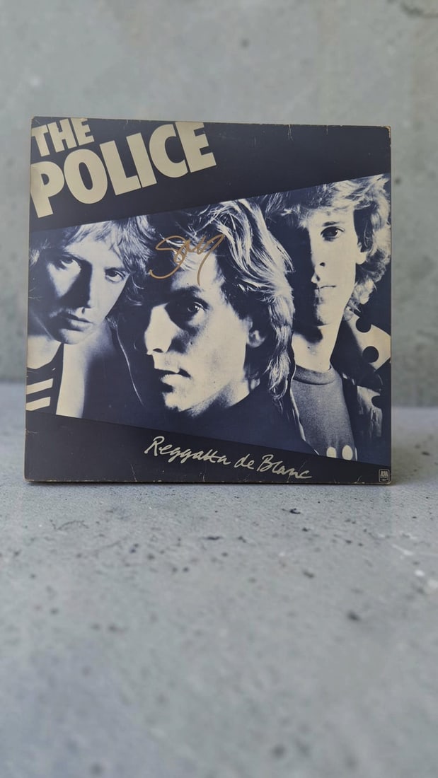 Sting The Police Reggatta de Blanc Signed Vinyl LP: This lot is a vinyl LP (Reggatta de Blanc), autographed by Sting of The Police. If you wish to upgrade to a third party authentication with holographic QR code and item scoring, an additional charge o