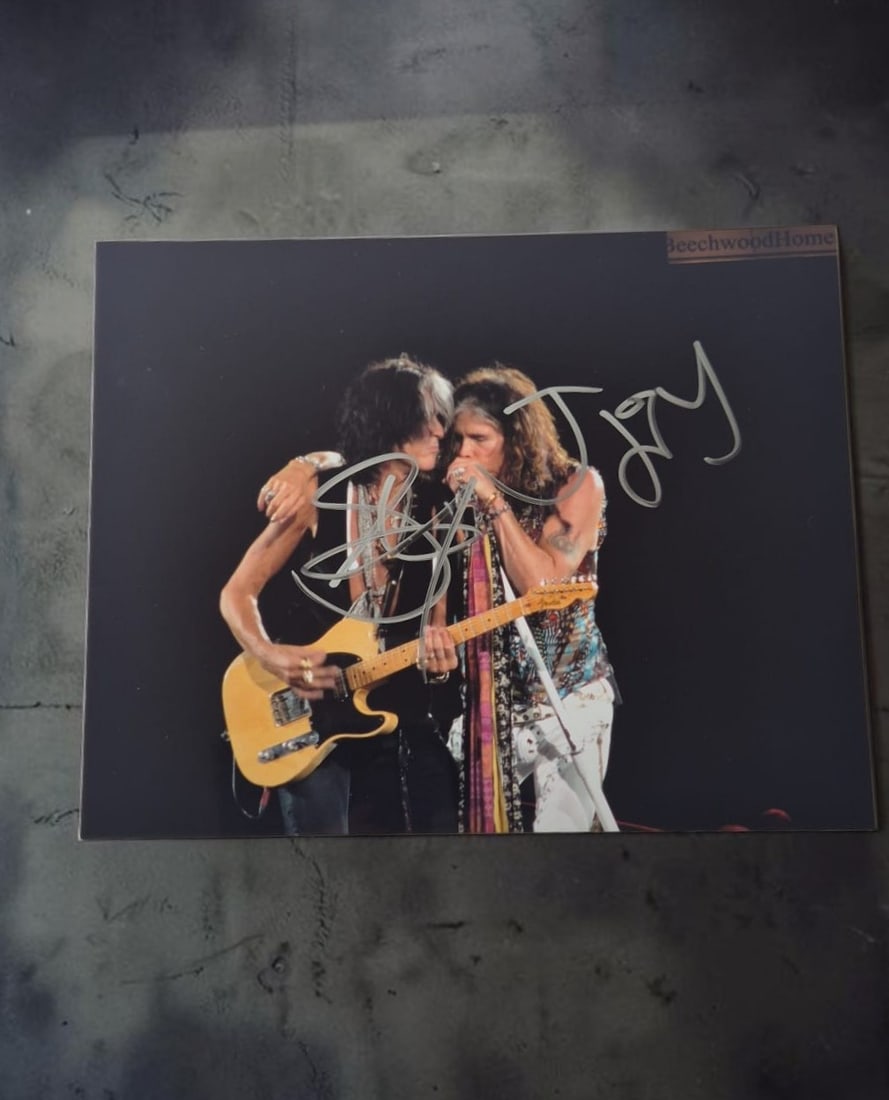 Aerosmith Signed Photograph: This lot is a photograph, autographed by Steven Tyler and Joe Perry of Aerosmith. If you wish to upgrade to a third party authentication with holographic QR code and item scoring, an additional