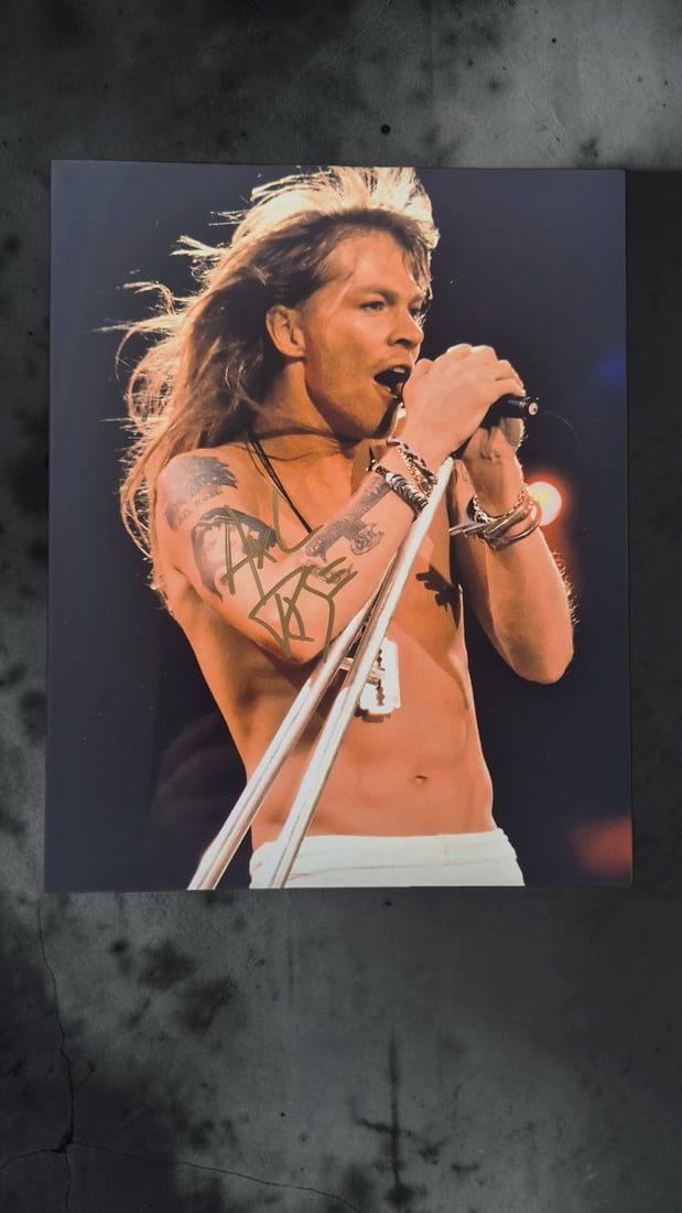 Axl Rose Guns N' Roses Signed Photograph: This lot is a photograph, autographed by Axl Rose of Guns N' Roses. If you wish to upgrade to a third party authentication with holographic QR code and item scoring, an additional charge of 30 UK poun