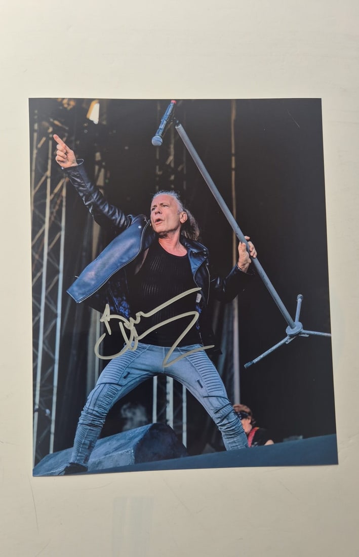 Bruce Dickinson Iron Maiden Signed Photograph: This lot is a photograph, autographed by Bruce Dickinson of Iron Maiden. If you wish to upgrade to a third party authentication with holographic QR code and item scoring, an additional charge of 30 UK
