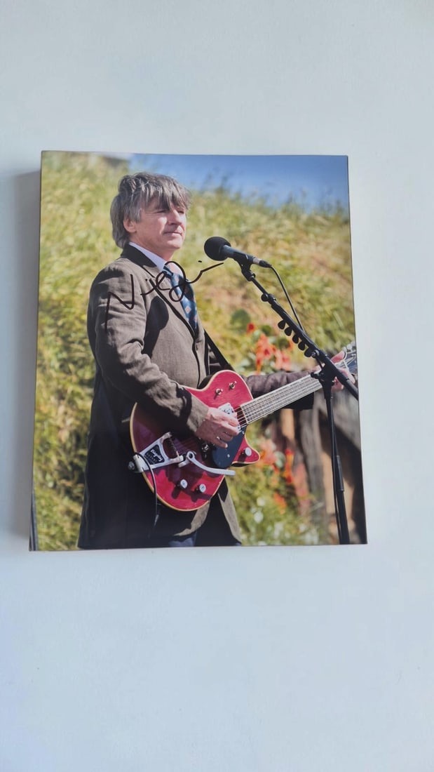Neil Finn Crowded House And Fleetwood Mac Signed Photograph: This lot is a photograph, autographed by Neil Finn of Crowded House and Fleetwood Mac. If you wish to upgrade to a third party authentication with holographic QR code and item scoring, an additional c