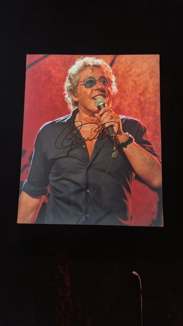 Roger Daltrey The Who Signed Photograph: This lot is a photograph, autographed by Roger Daltrey of The Who. If you wish to upgrade to a third party authentication with holographic QR code and item scoring, an additional charge of 30 UK