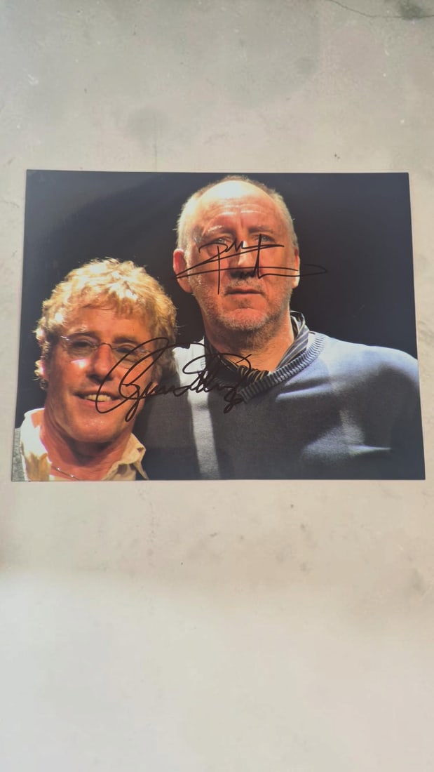 The Who Signed Photograph: This lot is a photograph, autographed by Roger Daltrey and Pete Townshend of The Who. If you wish to upgrade to a third party authentication with holographic QR code and item scoring, an additional ch