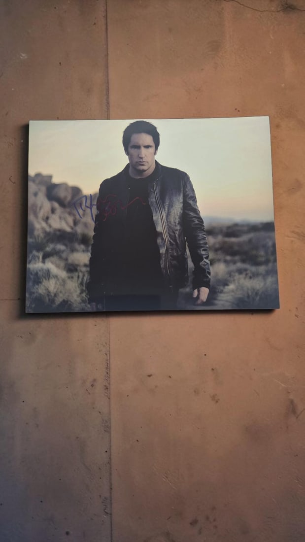 Trent Reznor Nine Inch Nails Signed Photograph: This lot is a photograph, autographed by Trent Reznor of Nine Inch Nails. If you wish to upgrade to a third party authentication with holographic QR code and item scoring, an additional charge of 30