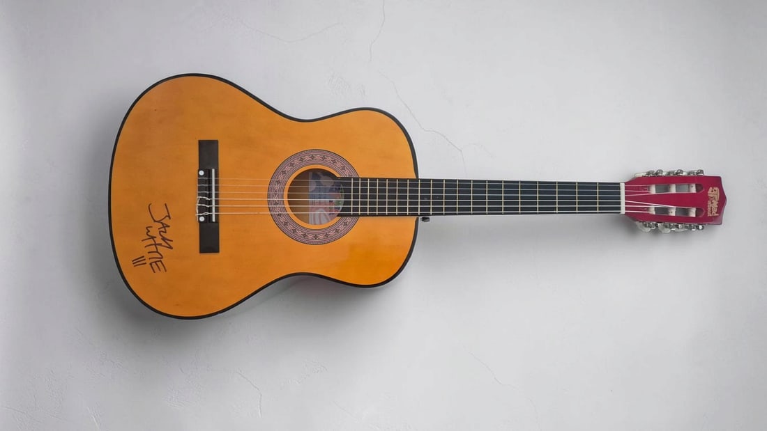 Jack White Signed Acoustic guitar: This lot is an acoustic guitar, autographed on the body by Jack White. If you wish to upgrade to a third party authentication with holographic QR code and item scoring, an additional charge of 30 UK P