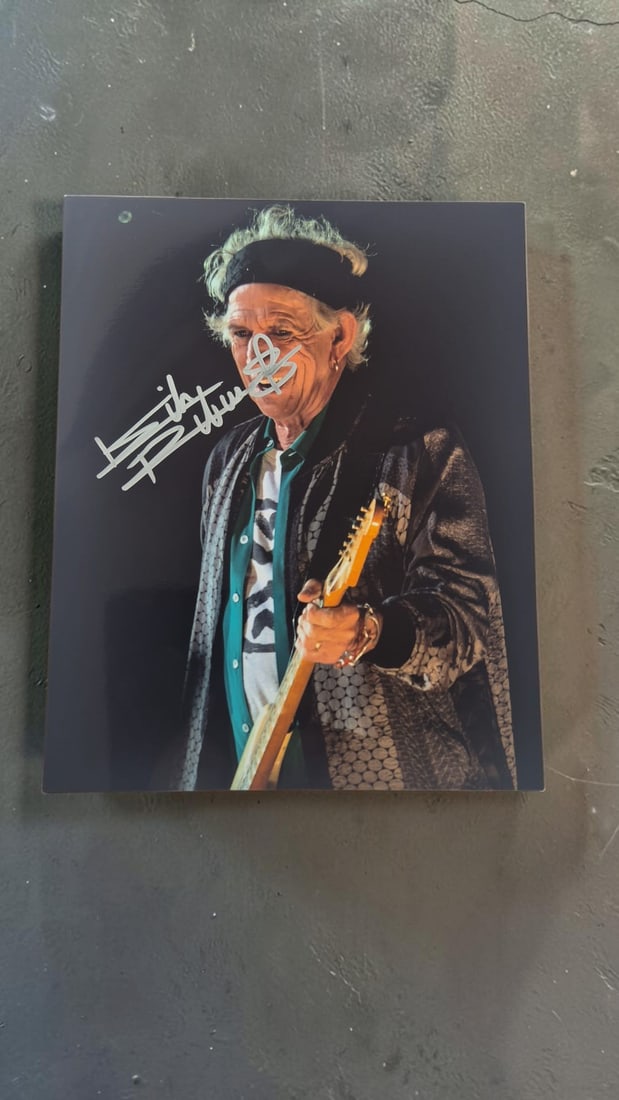 Keith Richards The Rolling Stones Signed Photograph: This lot is a photograph, autographed by Keith Richards of The Rolling Stones. If you wish to upgrade to a third party authentication with holographic QR code and item scoring, an additional charge of