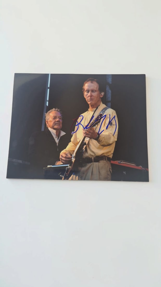 Robbie Krieger The Doors Signed Photograph: This lot is a photograph, autographed by Robbie Krieger of The Doors. If you wish to upgrade to a third party authentication with holographic QR code and item scoring, an additional charge of 30 UK