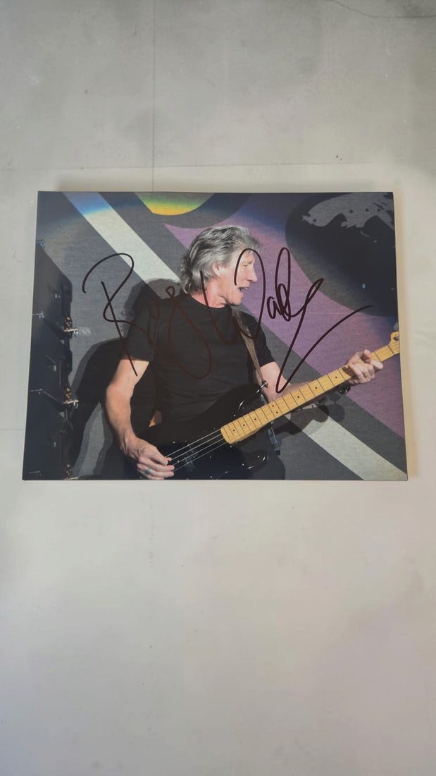 Roger Waters Pink Floyd Signed Photograph: This lot is a photograph, autographed by Roger Waters of Pink Floyd. If you wish to upgrade to a third party authentication with holographic QR code and item scoring, an additional charge of 30 UK