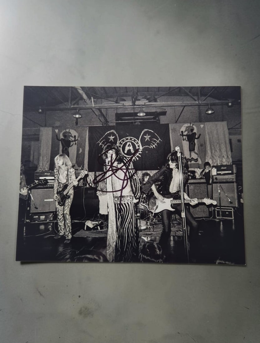 Steven Tyler Aerosmith Signed Photograph: This lot is an 8x10" photograph, autographed by Steven Tyler of Aerosmith. If you wish to upgrade to a third party authentication with holographic QR code and item scoring, an additional charge of 30 