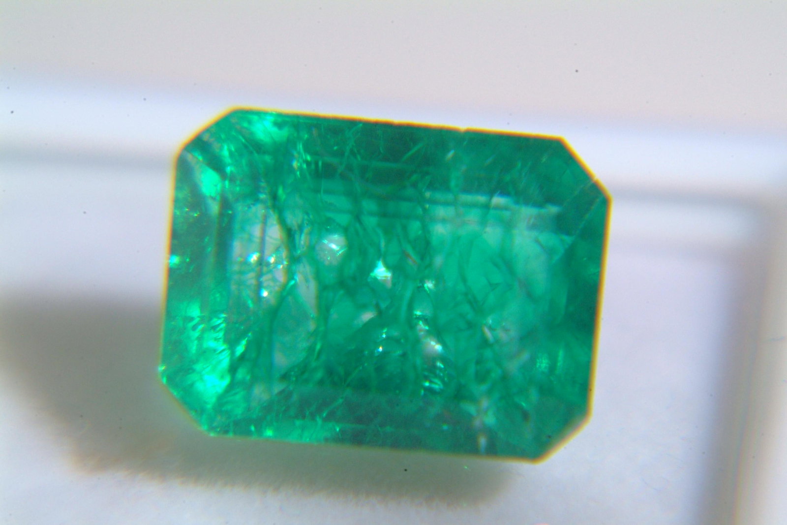 Emerald: Beryl 8.25Ct Origin: Tanzania Color: lvery bright green in color VVs quality,heated Refractive Index: RI1.58-157 Other Details: M.O.silk & firth DR Dimensions: 13.07 x 10.55 x 8.55mm Estimated Price P