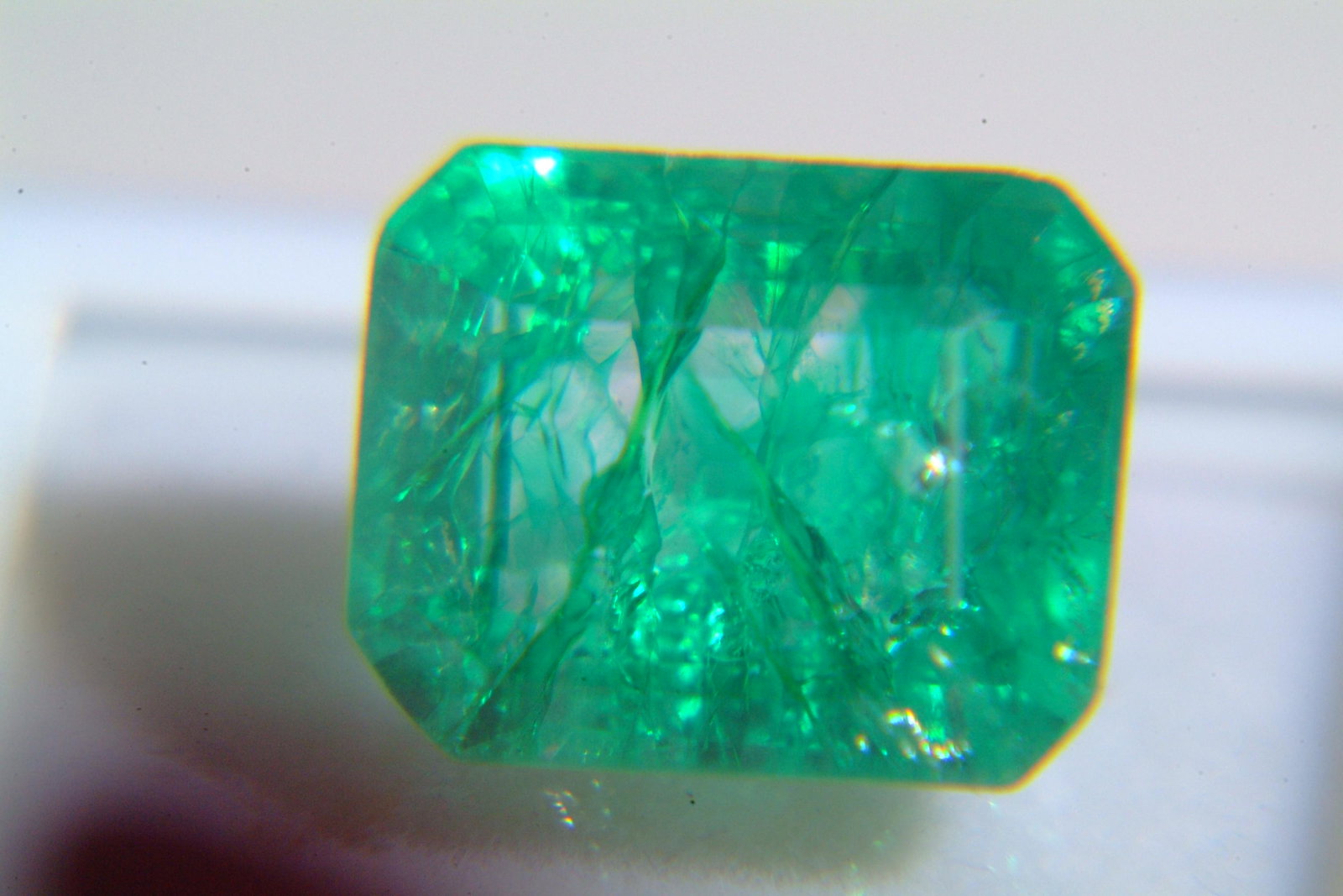 Emerald: Beryl 9.05 Ct Origin: Tanzania Color: very bright green in color VVs quality,heated Refractive Index: RI1.58-157 Other Details: M.O.silk & firth DR Dimensions: 13.07 x 10.55 x 8.55mm Estimated Price P