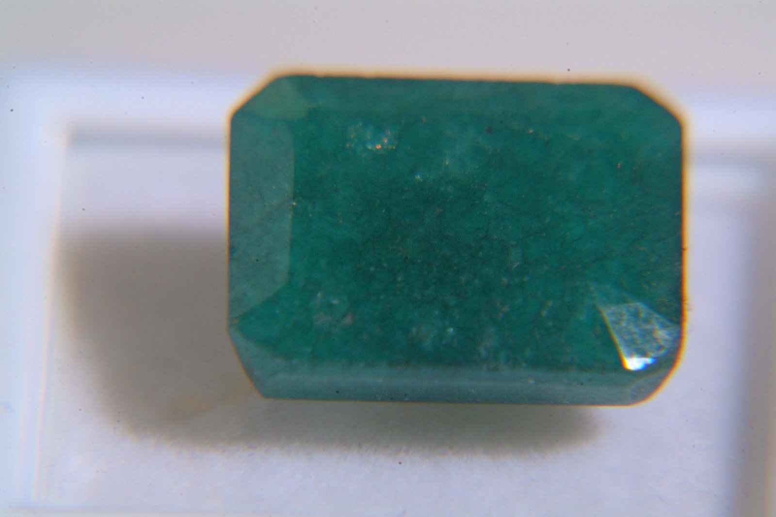 Emerald: Beryl 9.75 Ct Origin: columbia Color: Dark green in color, oil treated,no heat treatment,natural Refractive Index: RI1.58-157 Other Details: M.O.silk & firth DR Dimensions: 11.00 x 9.50 x 7.20mm Estim