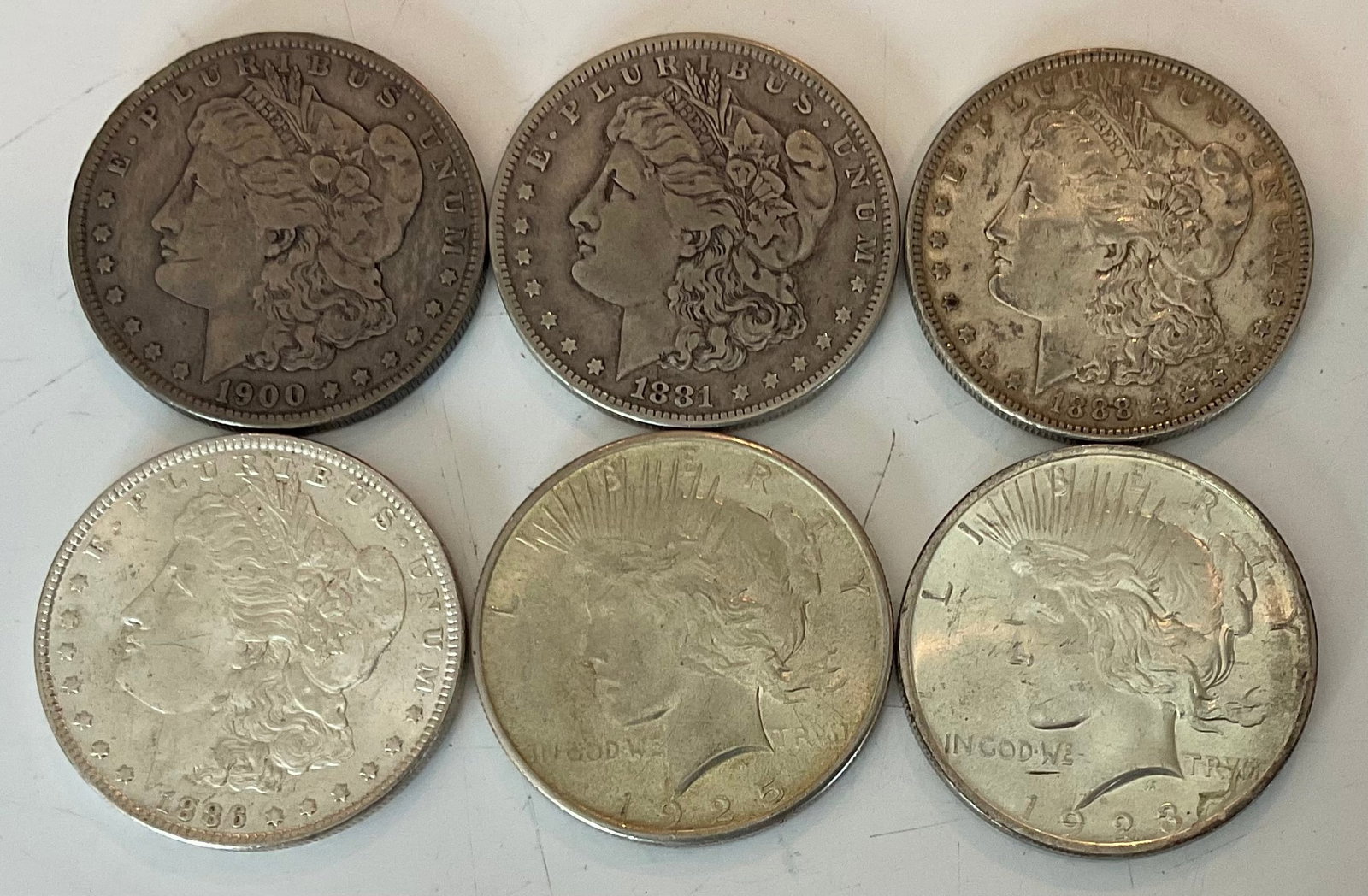 Group of six assorted 90 percent silver dollars 1 Carson City: Group of six assorted 90 percent silver dollars 1 Carson City, Dates 1881 CC, 1925, 1923, 1888, 1900 O, 1886