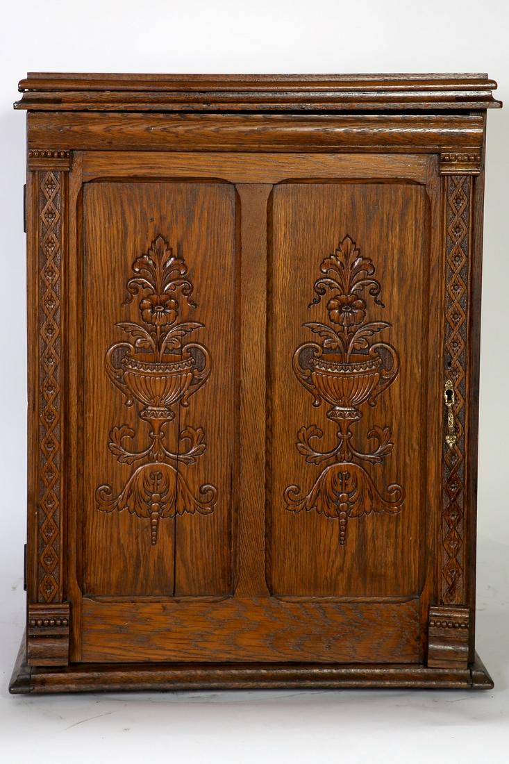 American Carved Oak Floor Model Sewing Machine: American Press Carved Oak Floor Model Sewing Machine with Richmond Stenciled Sewing machine. Condition:Good, refinished, one panel has a stress crack. Size : 22" W x 18" D x 29" H.