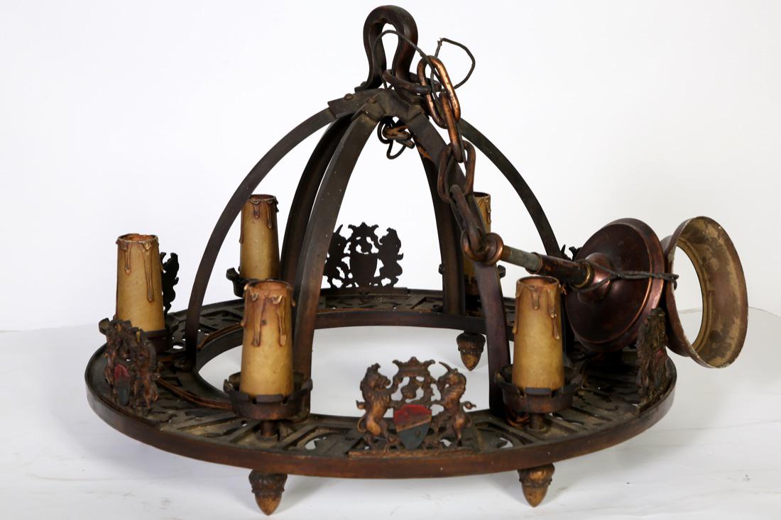 Art Deco Ornate Cast Bronze Rampant Lion Chandelier: Art Deco Ornate Cast Bronze Six Light Hanging Chandelier. Fixture has Rampant Lions, Unicorns, Shields,Tassels, and Acorns. Condition: Good Size: 21 3/4" in Diameter, Hangs 35" from the Ceiling.