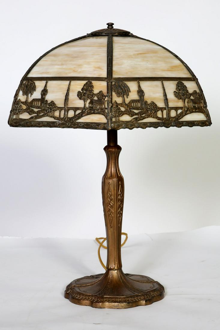Ornate Slag Glass Panel Table Lamp 18" Filigree Shade: Ornate Cast Iron Table Lamp With 18" Filigree Overlay Six Panel Slag Glass Shade. Condition:Good,cord replaced,old solder repair, loose joint on top of shade. Size: 18" D x 22 1/2" H