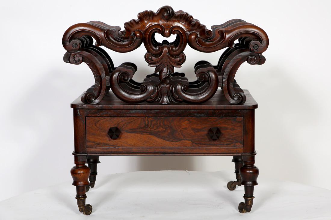 American Victorian Rococo Rosewood Ornate Canterbury: American Victorian Rococo Rosewood Ornate Canterbury, One Drawer, Turned Foot, Brass casters. Condition: Good, refinished, old stress crack repairs to top dividers. Size: 20" W x 14 1/2" D x 22" H