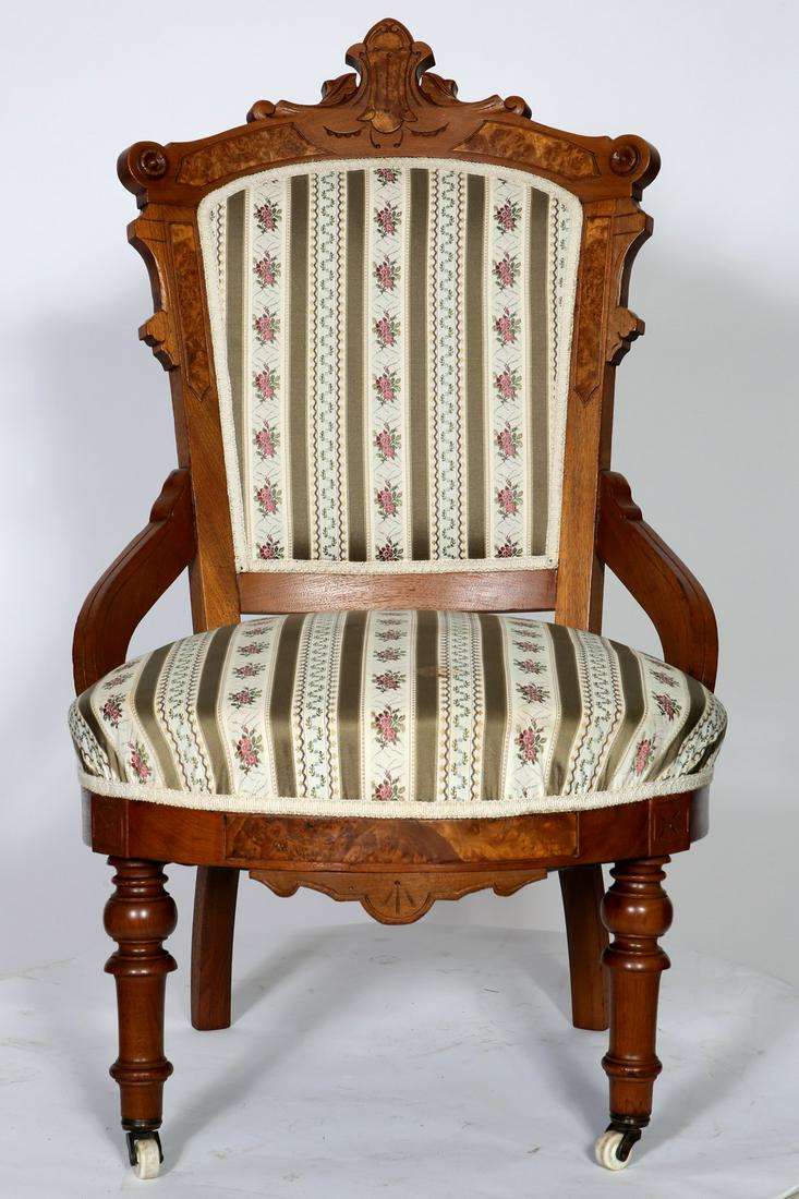 Walnut Victorian Renaissance Chair: Walnut Victorian Renaissance Chair,burled trim,turned legs,porcelain casters. Condition: Good, refinished. Size: 23 1/2" W x 21 1/2" D x 39" H