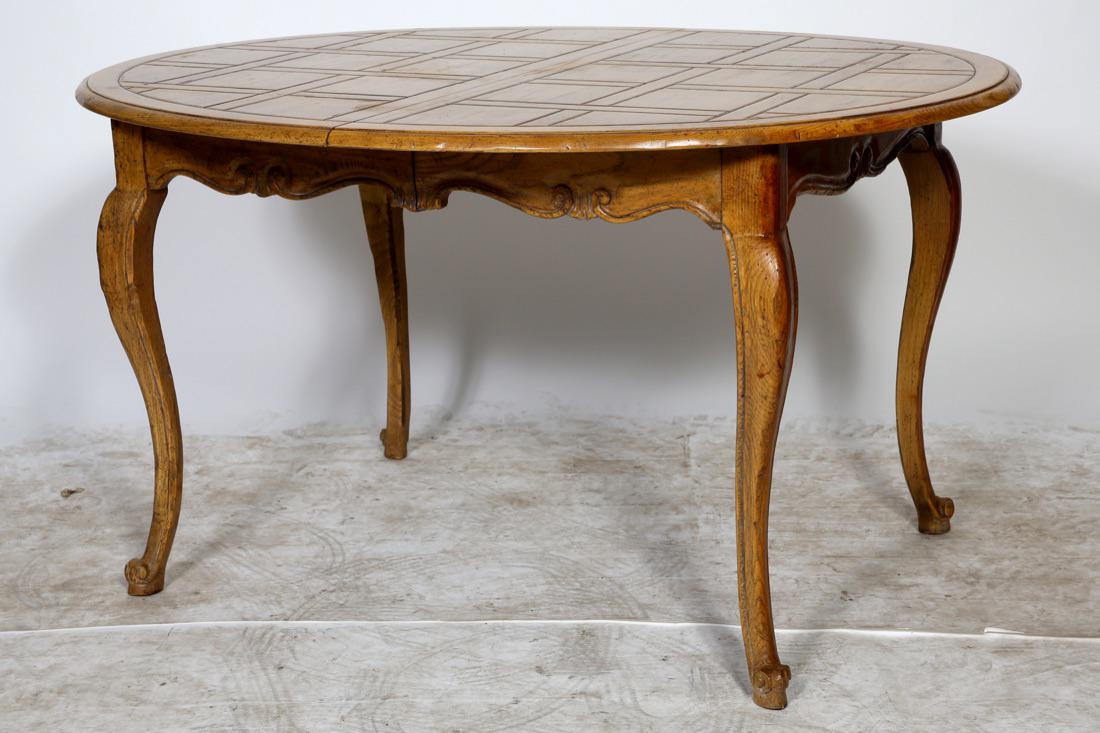 Baker Furniture French Provincial Dining Table: Baker Furniture French Provincial Dining Table w/one extension leaf. Signed w/Baker Oval Tag. Condition: Good with normal wear and scratches. Size: 53 1/2" W x 44 1/2" D x 29 1/2" H. Skirted table Lea