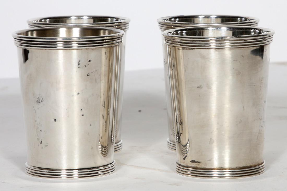 4 International Sterling Silver Mint Julep Cups: Set of 4 International Sterling Silver Mint Julep Cups, marked International Sterling 101 25 1. Approximate total weight of all four is 14.5833 troy ounces.Condition: Good with normal wear and scratch