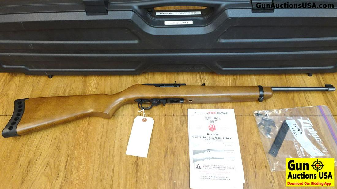 Ruger 10-22 .22 LR Semi Auto Rifle. Excellent: Ruger 10-22 .22 LR Semi Auto Rifle. Excellent Condition. 18" Barrel. Shiny Bore, Tight Action with Case. A Perfect, Do It All 22 Ruger, Straight Grained Stock with Minimal Handling Marks, An Extended 