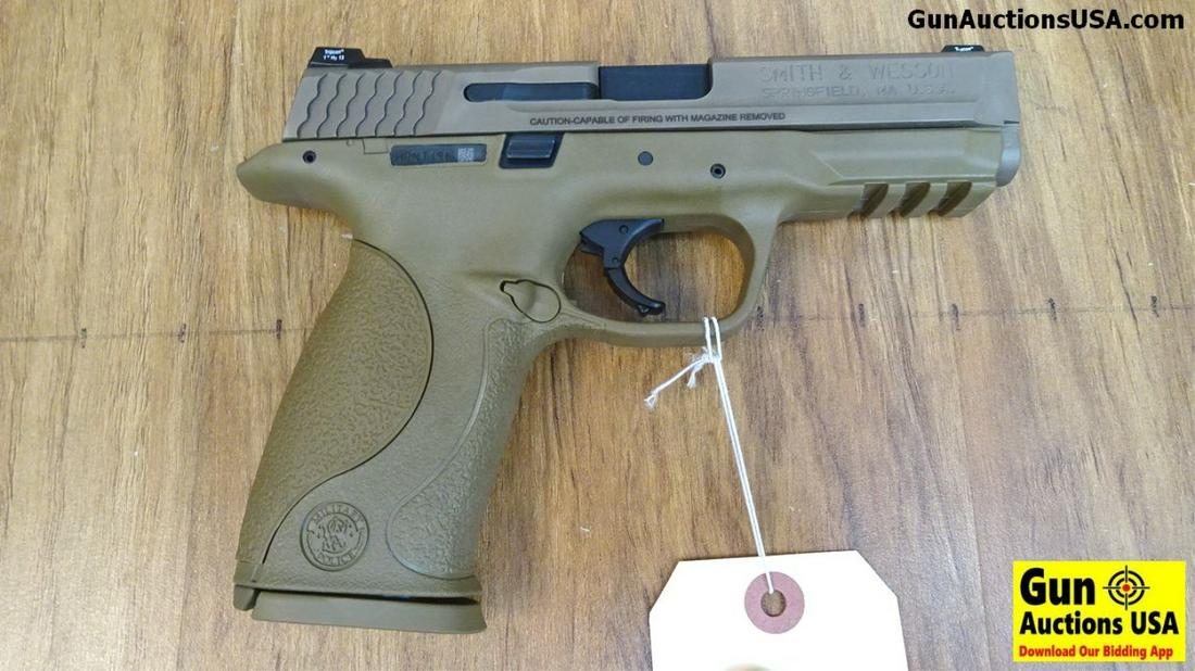S&W M&P 9 FDE 9MM Semi Auto Pistol. NEW in Box. 4.25": S&W M&P 9 FDE 9MM Semi Auto Pistol. NEW in Box. 4.25" Barrel. In Flat Dark Earth, Sports Vtac Fiberoptic and Night Sights. The Lower is Light Rail Ready, Includes 2 Original Magazines and 2 Replacemen